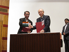 Photo of the signing ceremony with Dr. Ramasami