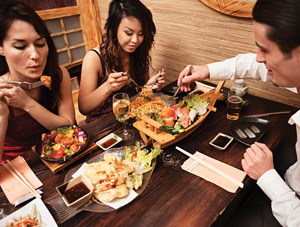 Image of people eating Japanese food