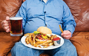 Image of a man eating fatty foods