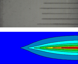 Image of damage tracks in optical crystal and the temperature distribution