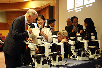 Image of Dr. Takahashi explaining to visitors