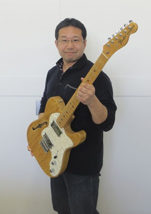 Picture of Tanaka and his guitar Picture of Tanaka and his guitar