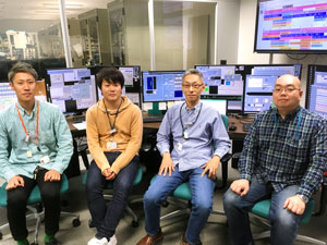 Image of Kenji Tamasaku and his team
